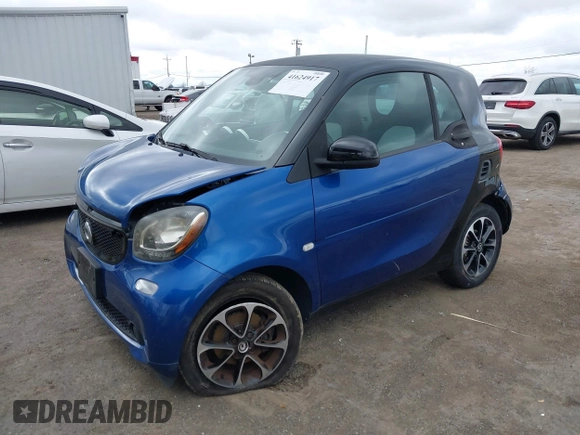 2016 Smart fortwo Passion z VIN WMEFJ5DA8GK059871, wystawiony jako IAAI lot #41624917 z przebiegiem 90 906 mil mil oraz . Historia ofert i sprzedaży dostępna na DreamBid. Obrazek 17.