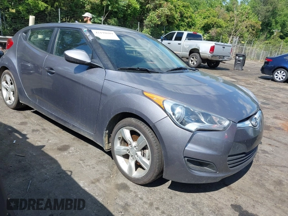 2013 Hyundai Veloster w/Gray Int with VIN KMHTC6ADXDU172104, listed as a IAAI auction lot 42198689 with 67,160 mi miles and . Bid and sale history available at DreamBid. Image 1.