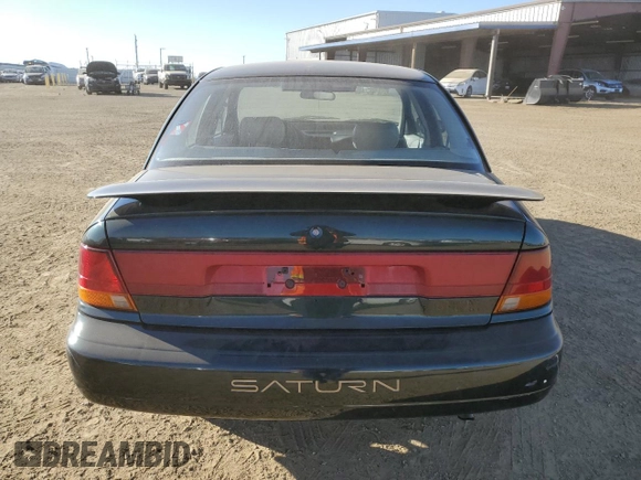 1996 Saturn SL z VIN 1G8ZK527XTZ335205, wystawiony jako Copart lot #42230735 z przebiegiem 82 344 mil mil oraz Szkoda całkowita • Salvage title. Historia ofert i sprzedaży dostępna na DreamBid. Obrazek 6.