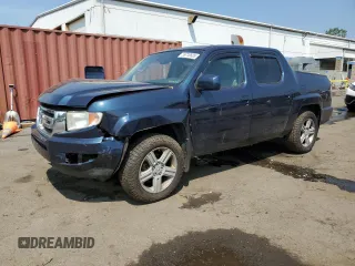 2010 Honda Ridgeline RTL with VIN 5FPYK1F5XAB004153, listed as a Copart auction lot 59710535 with Not provided miles and Salvage title. Bid and sale history available at DreamBid. Image 1.