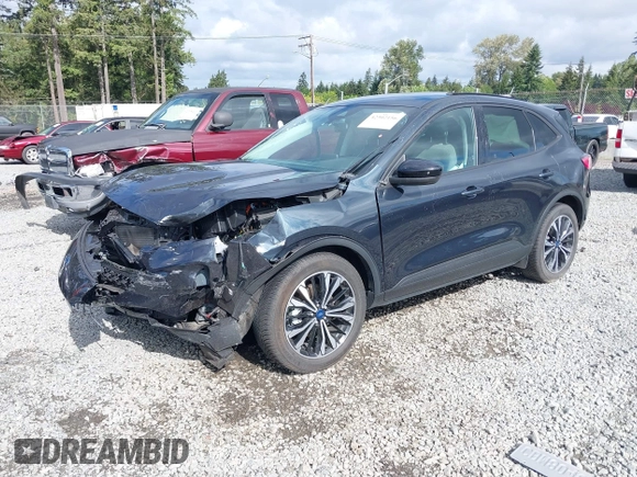 2022 Ford Escape SE Hybrid z VIN 1FMCU9BZ5NUA06681, wystawiony jako IAAI lot #42302156 z przebiegiem 61 582 mil mil oraz . Historia ofert i sprzedaży dostępna na DreamBid. Obrazek 2.