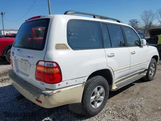 2000 Toyota Land Cruiser with VIN JT3HT05J5Y0126396, listed as a IAAI auction lot 41986185 with 201,156 mi miles. Bid and sale history available at carsss.com. Image 4.