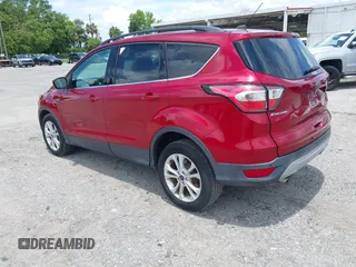 2017 Ford Escape SE z VIN 1FMCU0G95HUE86116, wystawiony jako IAAI lot #42397021 z przebiegiem 115 573 mil mil oraz . Historia ofert i sprzedaży dostępna na DreamBid. Obrazek 3.