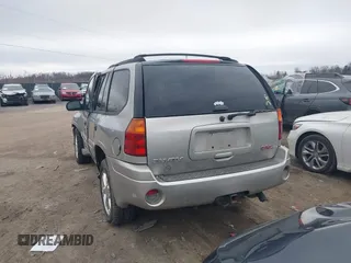 2004 GMC Envoy SLE with VIN 1GKDT13SX42135951, listed as a IAAI auction lot 41668252 with 216,193 mi miles. Bid and sale history available at carsss.com. Image 17.