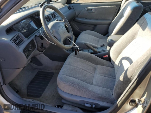 2000 Toyota Camry CE with VIN JT2BG22K0Y0461797, listed as a Copart auction lot 53646765 with 143,315 mi miles and Salvage Title. Bid and sale history available at carsss.com. Image 7.