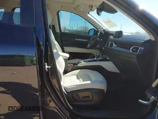 2020 Mazda CX-5 Grand Touring with VIN JM3KFBDMXL0763316, listed as a IAAI auction lot 41661958 with 64,881 mi miles and . Bid and sale history available at carsss.com. Image 5.