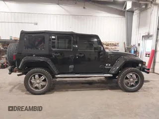 2008 Jeep Wrangler Unlimited X with VIN 1J4GA391X8L558984, listed as a IAAI auction lot 41016498 with 123,308 mi miles. Bid and sale history available at carsss.com. Image 13.