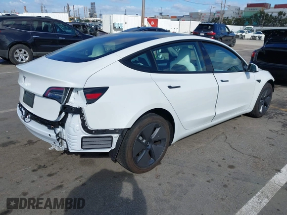 2023 Tesla Model 3 with VIN 5YJ3E1EA6PF495631, listed as a IAAI auction lot 41568118 with 10,073 mi miles and . Bid and sale history available at DreamBid. Image 4.