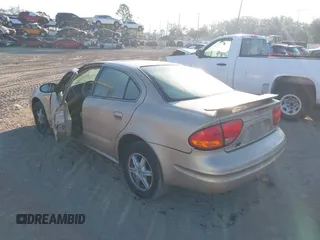 2004 Oldsmobile Alero GL1 z VIN 1G3NL52E34C191243, wystawiony jako IAAI lot #41536825 z przebiegiem 117 998 mil mil oraz . Historia ofert i sprzedaży dostępna na DreamBid. Obrazek 3.