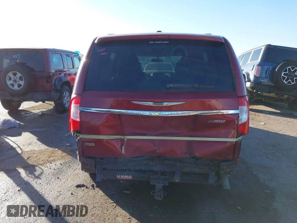 2013 Chrysler Town & Country Touring with VIN 2C4RC1BG2DR758951, listed as a IAAI auction lot 41136184 with 134,784 mi miles. Bid and sale history available at carsss.com. Image 6.