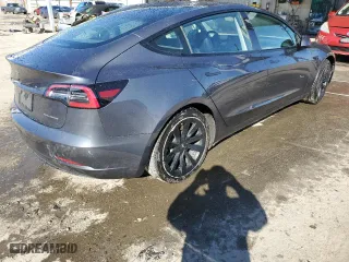 2022 Tesla Model 3 Long Range with VIN 5YJ3E1EB1NF125192, listed as a Copart auction lot 48877605 with 73,838 mi miles and Salvage Title. Bid and sale history available at carsss.com. Image 3.