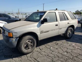 1997 Isuzu Rodeo z VIN 4S2CK58EXV4301951, wystawiony jako Copart lot #67468714 z przebiegiem 234 738 mil mil oraz Tytuł czysty. Historia ofert i sprzedaży dostępna na DreamBid. Obrazek 1.