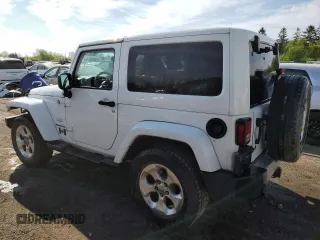 2013 Jeep Wrangler Sahara with VIN 1C4AJWBG0DL517849, listed as a Copart auction lot 58392505 with 119,499 mi miles and Clean title. Bid and sale history available at DreamBid. Image 2.
