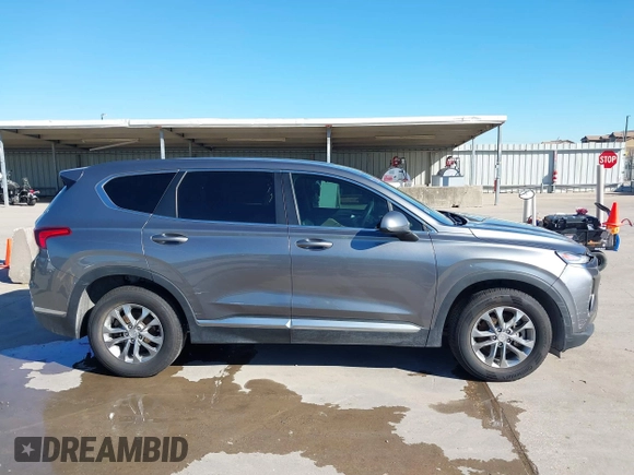 2019 Hyundai Santa Fe SE z VIN 5NMS23AD9KH037539, wystawiony jako IAAI lot #42221894 z przebiegiem 87 755 mil mil oraz . Historia ofert i sprzedaży dostępna na DreamBid. Obrazek 13.