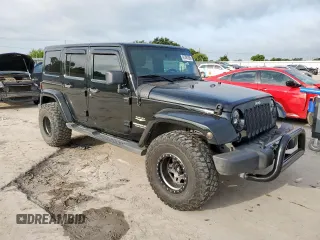 2012 Jeep Wrangler Unlimited Altitude with VIN 1C4HJWEGXCL180602, listed as a Copart auction lot 61391095 with 187,205 mi miles and Salvage title. Bid and sale history available at DreamBid. Image 4.