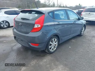 2012 Hyundai Accent SE with VIN KMHCU5AE4CU037411, listed as a IAAI auction lot 41659662 with 163,021 mi miles. Bid and sale history available at carsss.com. Image 4.