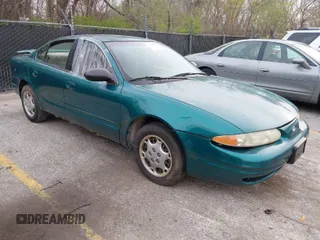 1999 Oldsmobile Alero GL z VIN 1G3NL52T7XC398799, wystawiony jako IAAI lot #41911602 z przebiegiem 252 504 mil mil oraz . Historia ofert i sprzedaży dostępna na DreamBid. Obrazek 1.