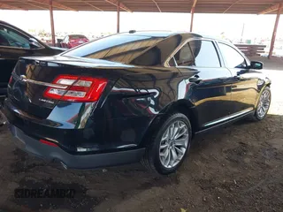 2015 Ford Taurus Limited with VIN 1FAHP2F8XFG135452, listed as a IAAI auction lot 42003510 with 71,476 mi miles. Bid and sale history available at carsss.com. Image 4.