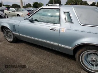 1977 Ford Thunderbird z VIN 7G87S303225, wystawiony jako Copart lot #74216404 z przebiegiem 48 305 mil mil oraz Szkody całkowita. Historia ofert i sprzedaży dostępna na DreamBid. Obrazek 12.
