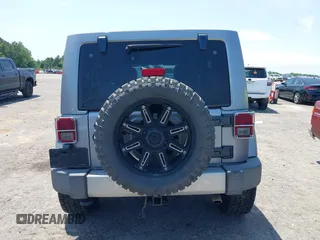 2013 Jeep Wrangler Unlimited Sahara with VIN 1C4BJWEG4DL666930, listed as a IAAI auction lot 42310569 with 206,577 mi miles and . Bid and sale history available at DreamBid. Image 16.