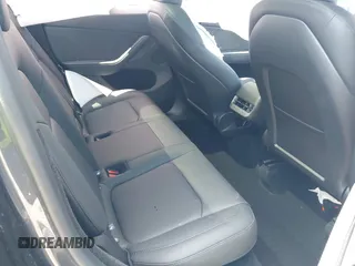 2024 Tesla Model Y with VIN 7SAYGDED9RA321373, listed as a IAAI auction lot 42228491 with 6,452 mi miles and . Bid and sale history available at DreamBid. Image 8.
