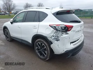 2016 Mazda CX-5 Grand Touring z VIN JM3KE4DY0G0705884, wystawiony jako IAAI lot #42016910 z przebiegiem 73 324 mil mil oraz . Historia ofert i sprzedaży dostępna na DreamBid. Obrazek 3.