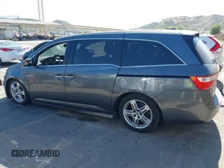 2011 Honda Odyssey Touring with VIN 5FNRL5H96BB009580, listed as a IAAI auction lot 42202595 with Not provided miles and . Bid and sale history available at DreamBid. Image 14.