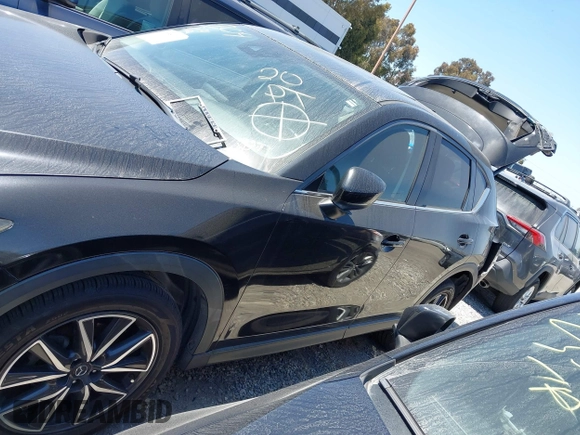 2018 Mazda CX-5 Grand Touring with VIN JM3KFADM4J0326760, listed as a IAAI auction lot 41885100 with 82,091 mi miles and . Bid and sale history available at DreamBid. Image 14.