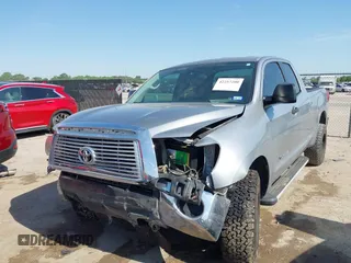 2011 Toyota Tundra with VIN 5TFRM5F18BX033833, listed as a IAAI auction lot 42257200 with 108,046 mi miles and . Bid and sale history available at DreamBid. Image 2.