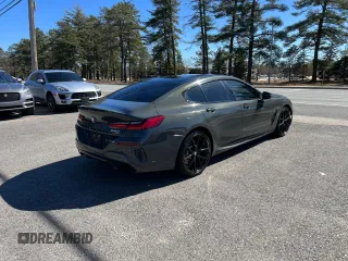 2021 BMW 8 Series 840i with VIN WBAGV2C02MCE96480, listed as a Copart auction lot 46827324 with 98,148 mi miles. Bid and sale history available at carsss.com. Image 3.