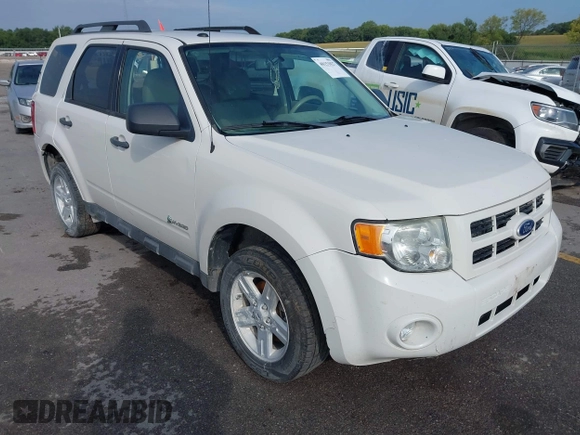 2010 Ford Escape Hybrid z VIN 1FMCU5K31AKD22069, wystawiony jako IAAI lot #40151027 z przebiegiem 185 932 mil mil oraz . Historia ofert i sprzedaży dostępna na DreamBid. Obrazek 1.