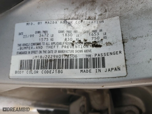 1999 Mazda Protege DX with VIN JM1BJ2229X0178306, listed as a Copart auction lot 50006525 with 215,749 mi miles and Salvage Title. Bid and sale history available at carsss.com. Image 12.