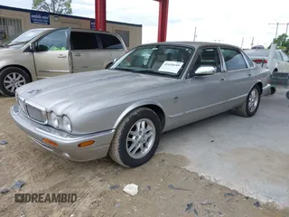 1999 Jaguar XJ with VIN SAJHX1043XC856474, listed as a IAAI auction lot 41626649 with 103,266 mi miles and . Bid and sale history available at DreamBid. Image 2.
