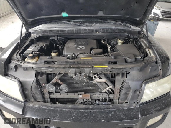 2007 Infiniti QX56 z VIN 5N3AA08A07N802904, wystawiony jako Copart lot #52902755 z przebiegiem 148 215 mil mil oraz Szkoda całkowita • Salvage title. Historia ofert i sprzedaży dostępna na DreamBid. Obrazek 12.