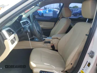 2018 BMW 3 Series 320i xDrive with VIN WBA8A3C55JA357532, listed as a Copart auction lot 57561015 with 46,876 mi miles and Salvage title. Bid and sale history available at DreamBid. Image 7.