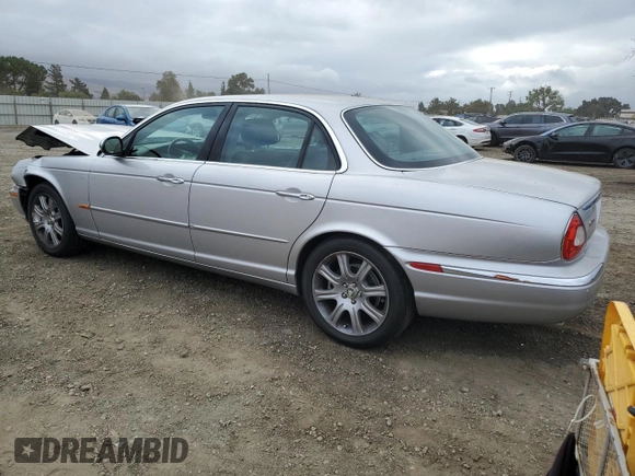 2004 Jaguar XJ with VIN SAJEA74C34SG09548, listed as a Copart auction lot 71754774 with 142,804 mi miles and Salvage Title. Bid and sale history available at DreamBid. Image 2.