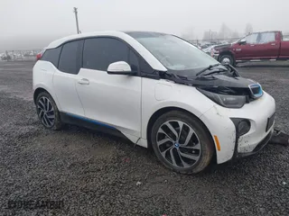 2014 BMW i3 with VIN WBY1Z4C55EV273629, listed as a IAAI auction lot 41337472 with 113,122 mi miles. Bid and sale history available at carsss.com. Image 1.