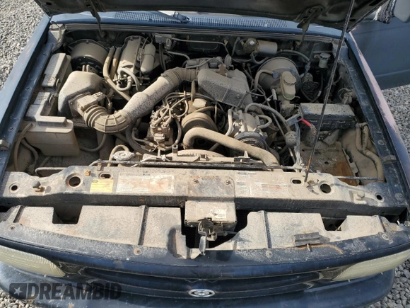 1994 Mazda B-Series Truck z VIN 4F4CR12AXRTM29986, wystawiony jako Copart lot #78825554 z przebiegiem 183 595 mil mil oraz Szkoda całkowita • Salvage title. Historia ofert i sprzedaży dostępna na DreamBid. Obrazek 11.