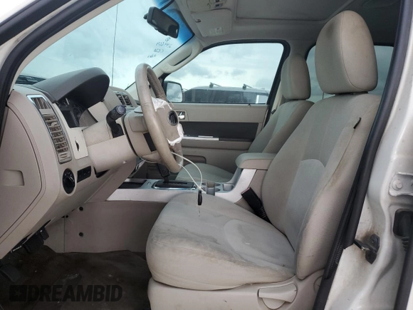 2009 Mercury Mariner with VIN 4M2CU81G49KJ16972, listed as a Copart auction lot 72354504 with 148,966 mi miles and Salvage title. Bid and sale history available at DreamBid. Image 7.