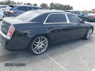 2013 Chrysler 300 with VIN 2C3CCAAG3DH565628, listed as a IAAI auction lot 42110710 with 204,362 mi miles. Bid and sale history available at carsss.com. Image 4.
