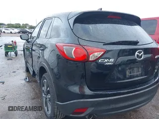 2016 Mazda CX-5 Grand Touring z VIN JM3KE4DY9G0605489, wystawiony jako IAAI lot #42085160 z przebiegiem 160 338 mil mil oraz . Historia ofert i sprzedaży dostępna na DreamBid. Obrazek 3.
