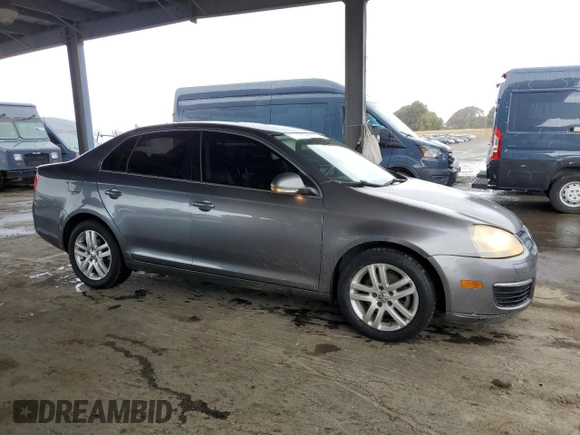 2007 Volkswagen Jetta z VIN 3VWDG71K47M101262, wystawiony jako Copart lot #51469695 z przebiegiem 241 174 mil mil oraz Szkoda całkowita • Salvage title. Historia ofert i sprzedaży dostępna na DreamBid. Obrazek 4.