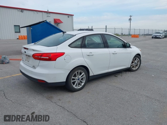 2015 Ford Focus SE with VIN 1FADP3F23FL255584, listed as a IAAI auction lot 41990636 with 151,389 mi miles. Bid and sale history available at carsss.com. Image 4.