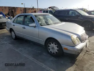 1998 Mercedes-Benz E 320 with VIN WDBJF25F3WA689755, listed as a Copart auction lot 51288455 with 124,157 mi miles and Salvage Title. Bid and sale history available at DreamBid. Image 4.