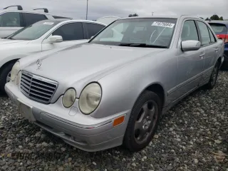 2001 Mercedes-Benz E-Class AWD with VIN WDBJF83J01X047817, listed as a Copart auction lot 71675084 with 143,127 mi miles and Salvage Title. Bid and sale history available at carsss.com. Image 1.