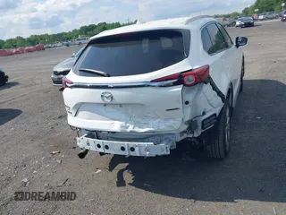2021 Mazda CX-9 Grand Touring z VIN JM3TCBDY2M0541290, wystawiony jako IAAI lot #42216643 z przebiegiem 38 661 mil mil oraz . Historia ofert i sprzedaży dostępna na DreamBid. Obrazek 16.