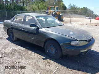 1995 Toyota Camry LE with VIN 4T1GK12E5SU860216, listed as a IAAI auction lot 41803933 with 235,130 mi miles. Bid and sale history available at carsss.com. Image 1.