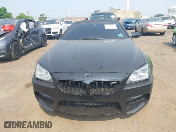 2014 BMW M6 z VIN WBSLZ9C5XEDZ78402, wystawiony jako IAAI lot #42399055 z przebiegiem 127 803 mil mil oraz . Historia ofert i sprzedaży dostępna na DreamBid. Obrazek 12.