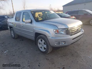 2014 Honda Ridgeline RTL with VIN 5FPYK1F57EB009199, listed as a IAAI auction lot 41208488 with 100,340 mi miles. Bid and sale history available at carsss.com. Image 1.