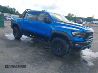 2021 Ram 1500 TRX with VIN 1C6SRFU98MN804461, listed as a IAAI auction lot 42300032 with 28,735 mi miles and . Bid and sale history available at DreamBid. Image 1.